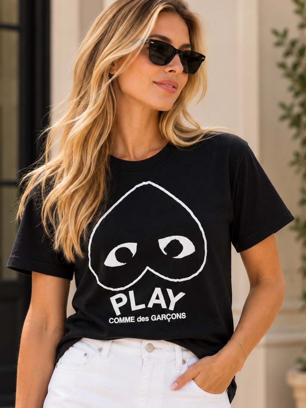 Comme des Garçons PLAY Black Tee with White Heart-Eye Graphic. Firm price